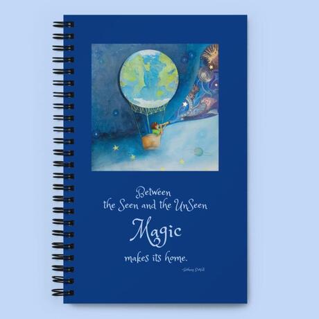 Journal with cover art of a child in a hot air balloon and the quote: Between the seen and the unseen Magic makes its home.